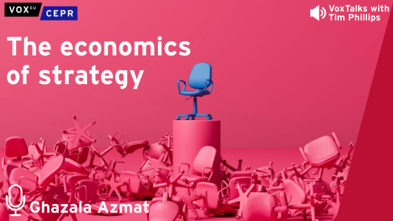 A single blue office chair sits elevated on a podium surrounded by overturned pink chairs, with the text "The economics of strategy" and "VoxTalks with Tim Phillips." With a microphone icon next to the name "Ghazala Azmat"